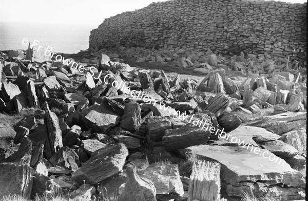 OLD SETTLEMENT WITH ROCKS ON SHORELINE